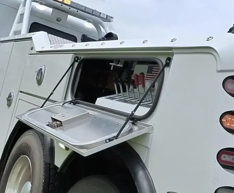 Titan service-truck toolbox with the tools and parts carried to a roadside repair.